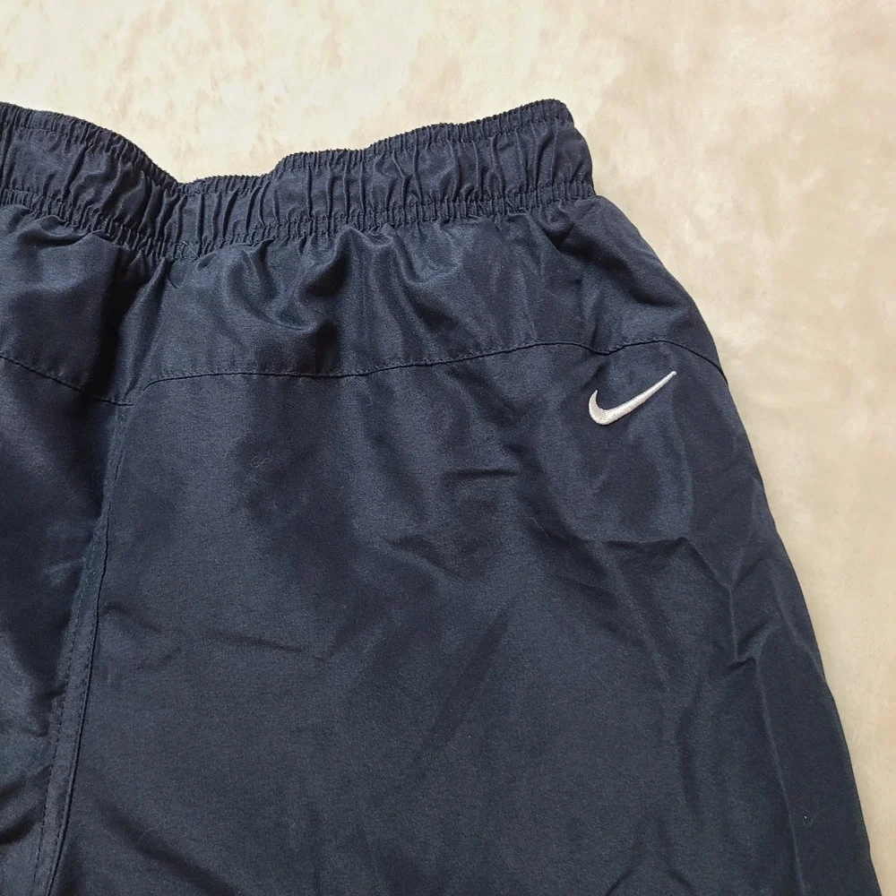 VTG NIKE gym Shorts Medium Mesh Lining Swim Trunks Swoosh Logo Pockets